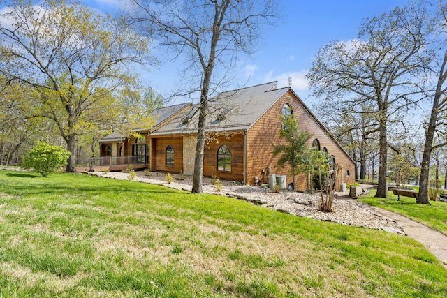 234 Sunset Cv Unit 107, Branson, MO 65616 - rear view of house featuring a lawn