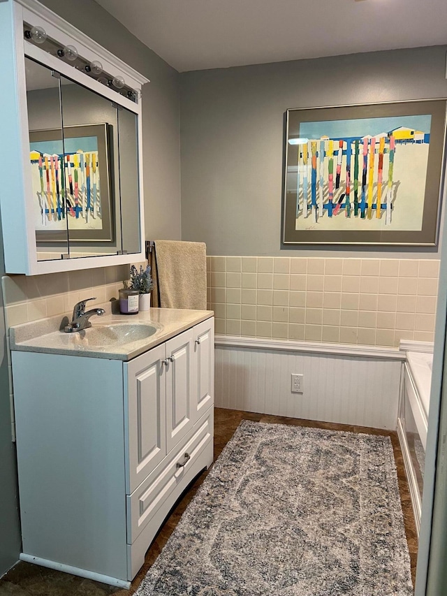 234 Sunset Cv Unit 107, Branson, MO 65616 - bathroom featuring vanity and a wainscoted wall