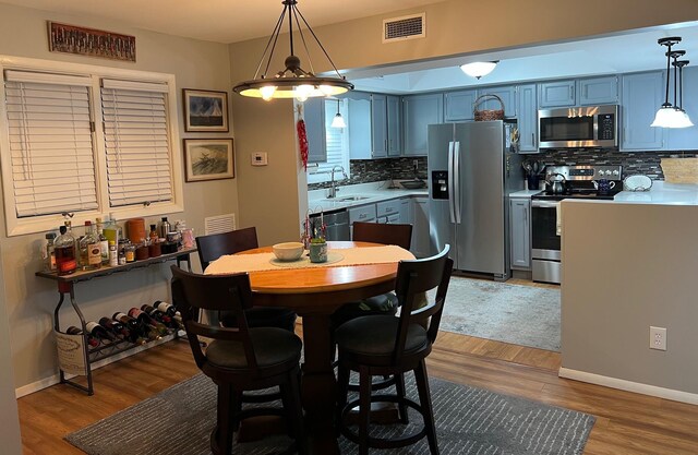 234 Sunset Cv Unit 107, Branson, MO 65616 - dining room with wood finished floors and baseboards