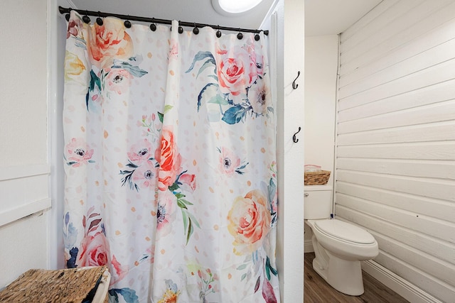 214 Rudolph St, Seymour, MO 65746 - bathroom with toilet, wood finished floors, and a shower with curtain