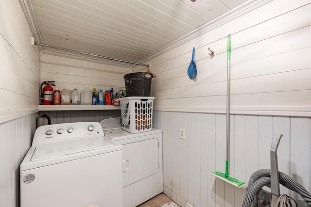 214 Rudolph St, Seymour, MO 65746 - laundry room featuring washing machine and dryer and wooden walls
