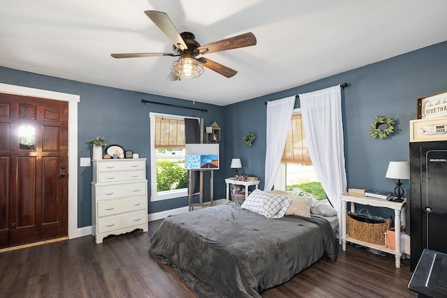 214 Rudolph St, Seymour, MO 65746 - bedroom with wood finished floors, ceiling fan, and baseboards