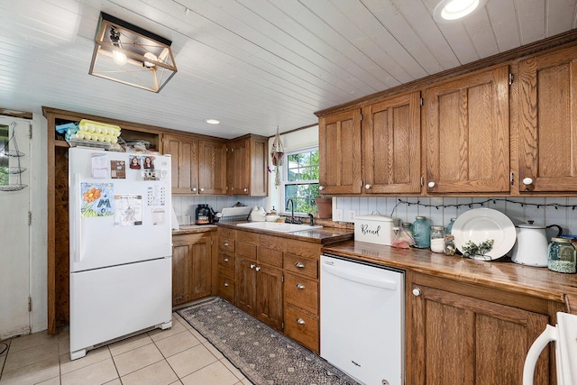 214 Rudolph St, Seymour, MO 65746 - kitchen with white appliances, a sink, brown cabinets, wood ceiling, and recessed lighting
