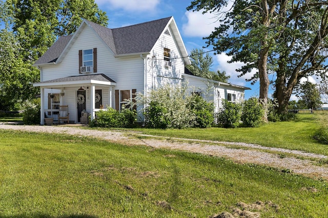 214 Rudolph St, Seymour, MO 65746 - view of front facade featuring a porch, a shingled roof, and a front lawn