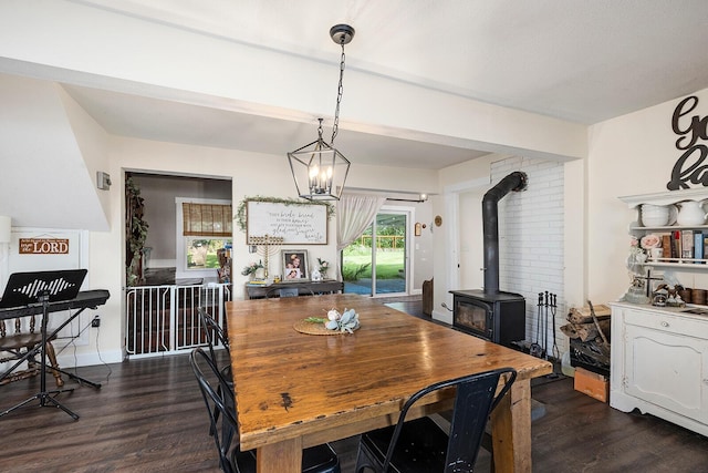 214 Rudolph St, Seymour, MO 65746 - dining space with dark wood finished floors and a wood stove