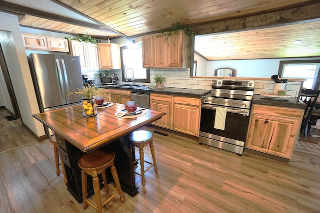 20770 State Highway 76, Cassville, MO 65625 - kitchen with appliances with stainless steel finishes, wood ceiling, dark countertops, a sink, and a peninsula