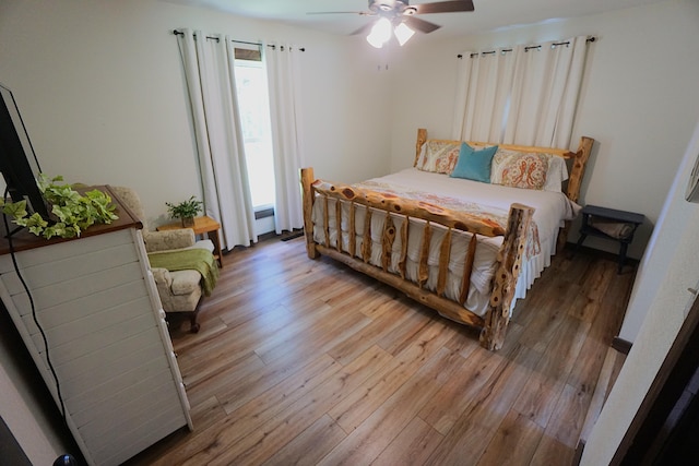 20770 State Highway 76, Cassville, MO 65625 - bedroom featuring light wood-style flooring and a ceiling fan