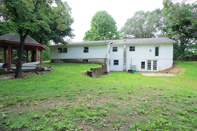 20770 State Highway 76, Cassville, MO 65625 - back of house with french doors, a gazebo, a yard, a chimney, and a patio area