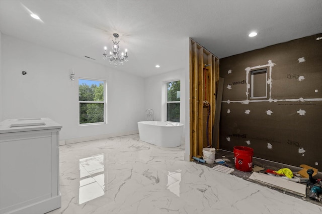 176 Shooting Star Ln, Nixa, MO 65714 - bathroom with a soaking tub, recessed lighting, a chandelier, and marble finish floors