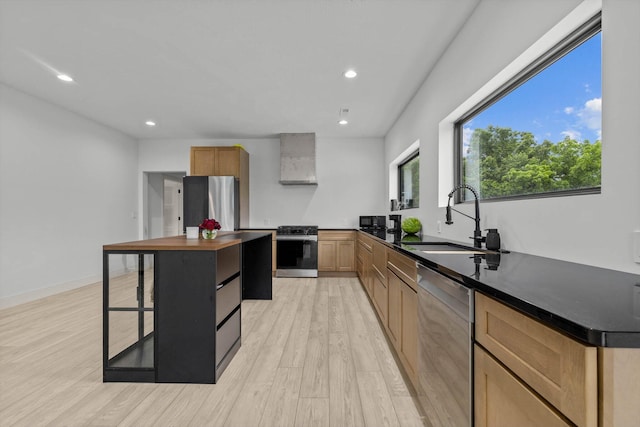 176 Shooting Star Ln, Nixa, MO 65714 - kitchen with appliances with stainless steel finishes, a sink, wall chimney exhaust hood, light wood-type flooring, and recessed lighting