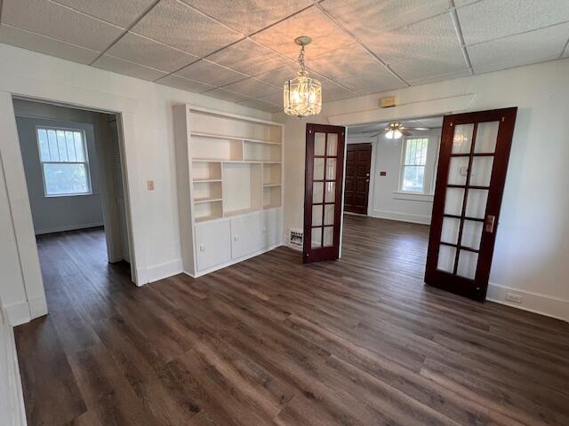935 W Brower St, Springfield, MO 65802 - unfurnished dining area with french doors, baseboards, dark wood-type flooring, and healthy amount of natural light