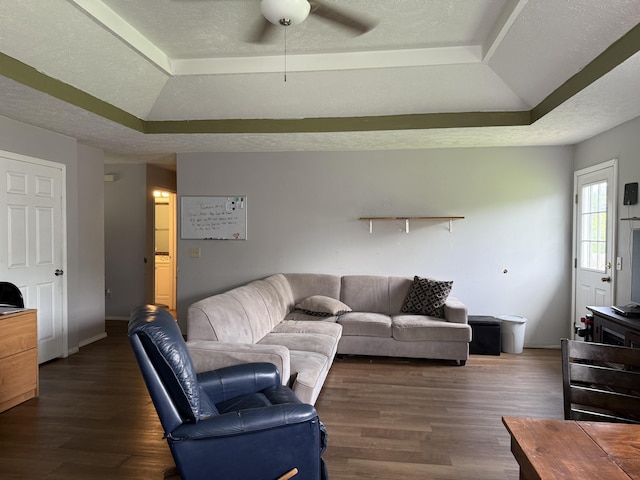 208 Justin St, Rogersville, MO 65742 - living room featuring a tray ceiling, a ceiling fan, wood finished floors, a textured ceiling, and baseboards
