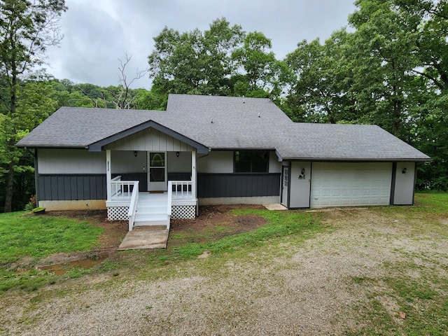 29039 Nottinghill Dr, Shell Knob, MO 65747 - view of front of home with a porch, roof with shingles, and a garage