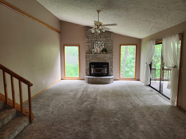 29039 Nottinghill Dr, Shell Knob, MO 65747 - unfurnished living room featuring vaulted ceiling, a ceiling fan, carpet, a textured ceiling, and stairway