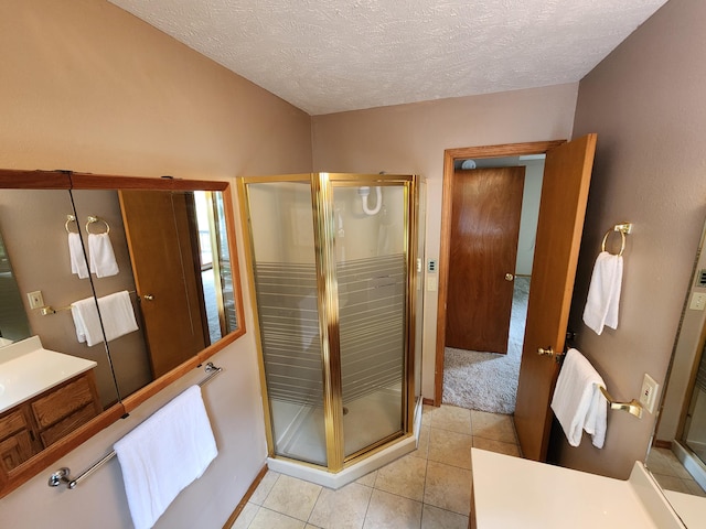 29039 Nottinghill Dr, Shell Knob, MO 65747 - full bathroom with vanity, a shower stall, a textured ceiling, and tile patterned flooring