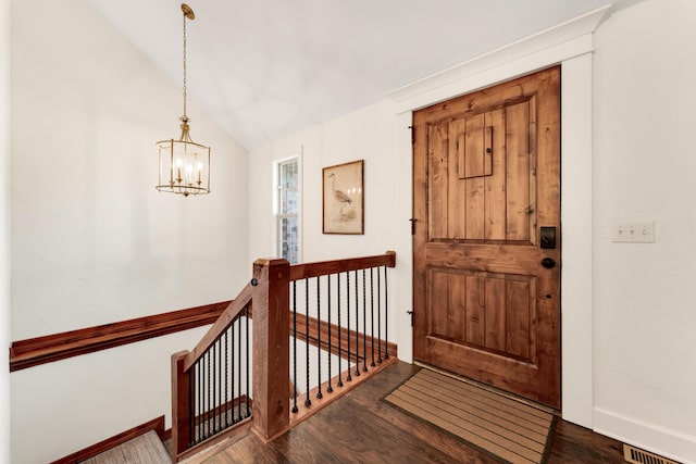 2029 Moon Valley Rd, Ozark, MO 65721 - foyer featuring wood finished floors, a chandelier, lofted ceiling, and baseboards