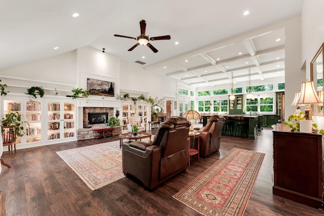 2029 Moon Valley Rd, Ozark, MO 65721 - living area featuring a towering ceiling, a ceiling fan, a stone fireplace, dark wood-style flooring, and beamed ceiling