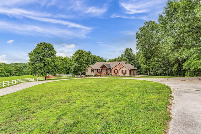 2029 Moon Valley Rd, Ozark, MO 65721 - tudor home featuring curved driveway, a wooded view, and stone siding