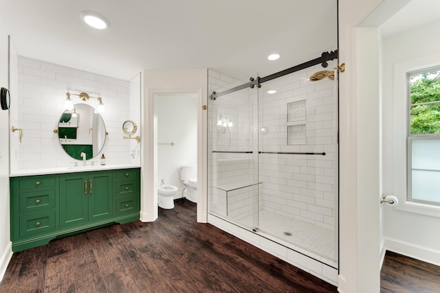 2029 Moon Valley Rd, Ozark, MO 65721 - bathroom with a bidet, a shower stall, vanity, wood finished floors, and toilet