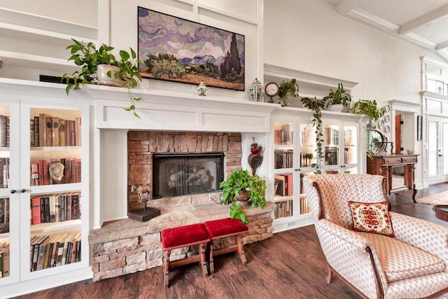 2029 Moon Valley Rd, Ozark, MO 65721 - living area with a stone fireplace, dark wood-type flooring, beamed ceiling, and a towering ceiling