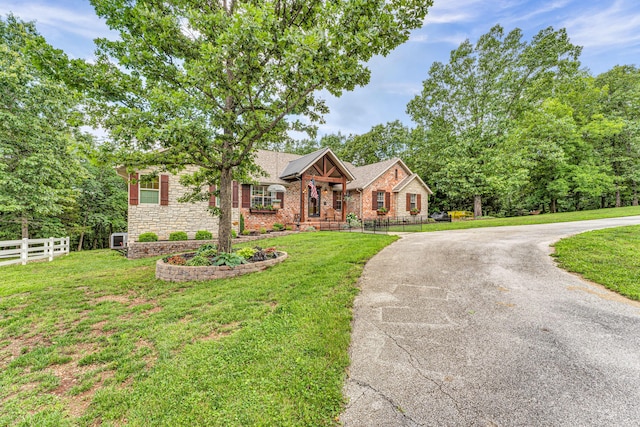 2029 Moon Valley Rd, Ozark, MO 65721 - single story home featuring stone siding and curved driveway