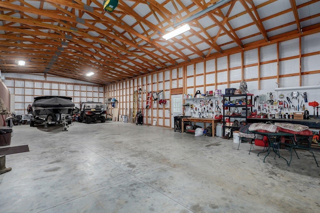 123 Fossil Cove Rd, Cape Fair, MO 65624 - garage featuring a workshop area and metal wall
