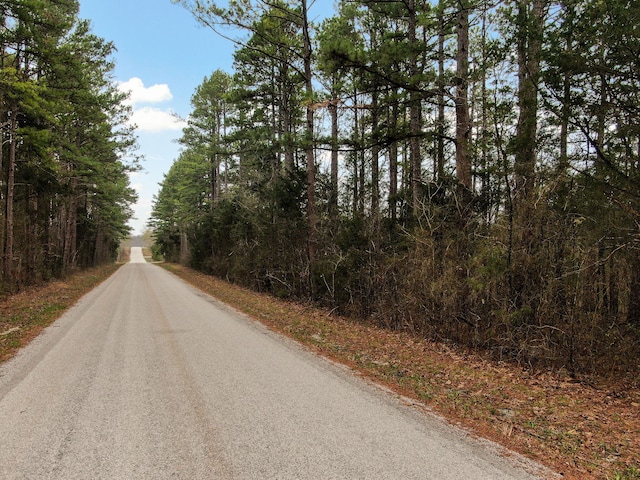 123 Fossil Cove Rd, Cape Fair, MO 65624 - view of asphalt road with a forest view
