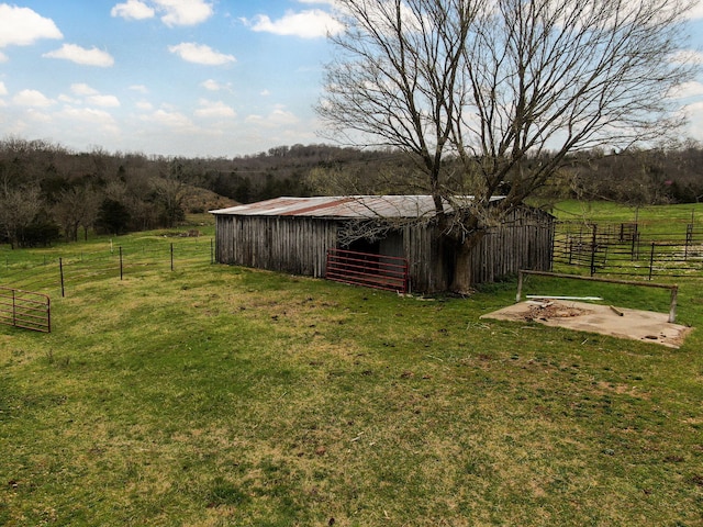 123 Fossil Cove Rd, Cape Fair, MO 65624 - view of yard featuring a pole building, an outdoor structure, and a view of countryside