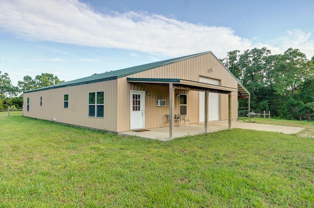 123 Fossil Cove Rd, Cape Fair, MO 65624 - back of house featuring a garage, driveway, and a yard