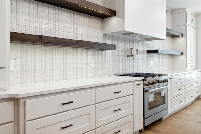 4943 S Aaron Ave, Springfield, MO 65810 - kitchen with open shelves, stainless steel range, decorative backsplash, and white cabinets