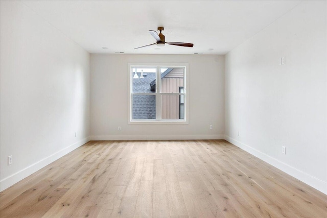 4943 S Aaron Ave, Springfield, MO 65810 - unfurnished room with wood finished floors, a ceiling fan, and baseboards