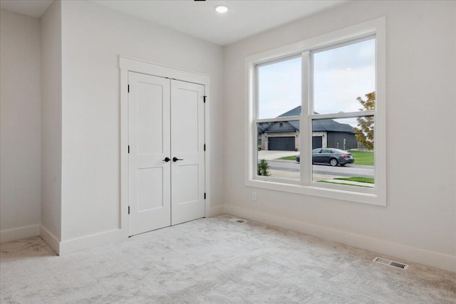 4943 S Aaron Ave, Springfield, MO 65810 - unfurnished bedroom featuring carpet flooring, baseboards, and a closet