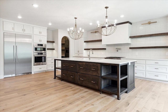 4943 S Aaron Ave, Springfield, MO 65810 - kitchen with open shelves, stainless steel appliances, a chandelier, light countertops, and recessed lighting