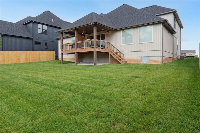 4943 S Aaron Ave, Springfield, MO 65810 - back of property featuring stairs, a deck, a yard, ceiling fan, and cooling unit
