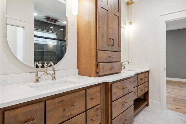 4943 S Aaron Ave, Springfield, MO 65810 - bathroom with double vanity, an enclosed shower, baseboards, and marble finish floors