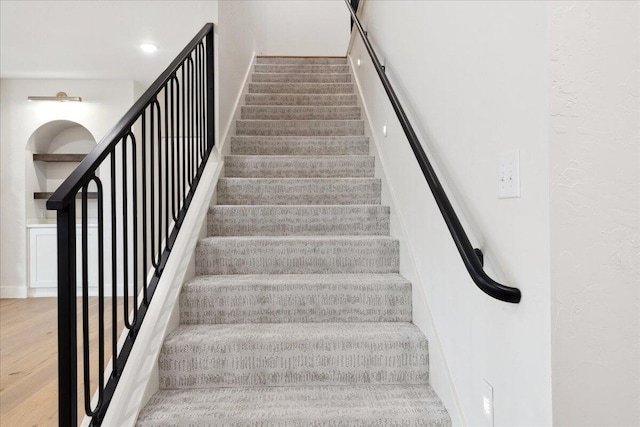 4943 S Aaron Ave, Springfield, MO 65810 - stairs with wood finished floors and a textured wall