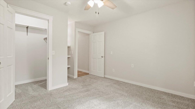 2606 Country Dr, Mountain Grove, MO 65711 - unfurnished bedroom featuring light colored carpet, baseboards, ceiling fan, and a closet