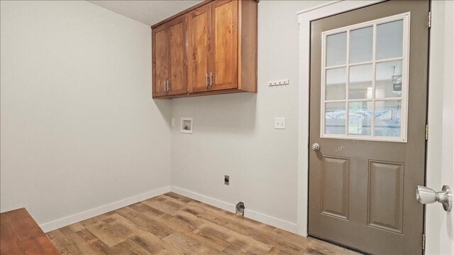 2606 Country Dr, Mountain Grove, MO 65711 - laundry room featuring hookup for a washing machine, cabinet space, electric dryer hookup, and light wood finished floors