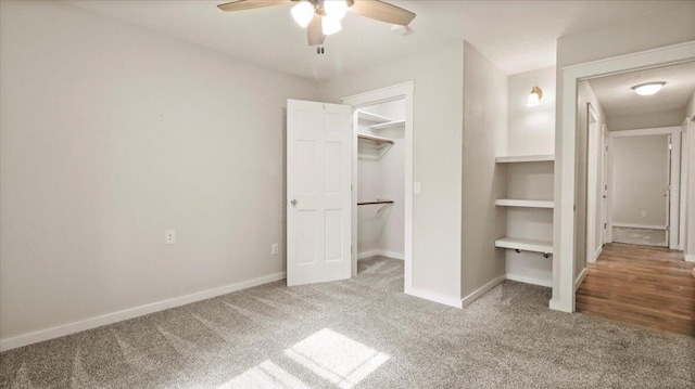 2606 Country Dr, Mountain Grove, MO 65711 - unfurnished bedroom featuring carpet flooring, a spacious closet, baseboards, ceiling fan, and a closet