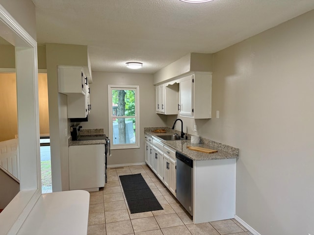 2004 S 16th St, Ozark, MO 65721 - kitchen featuring a sink, range, stainless steel dishwasher, light tile patterned floors, and white cabinets