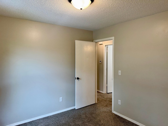 2004 S 16th St, Ozark, MO 65721 - spare room with dark carpet, a textured ceiling, and baseboards