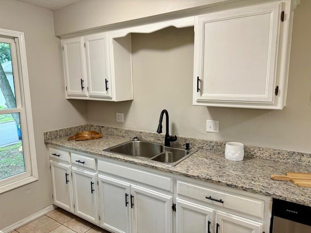 2004 S 16th St, Ozark, MO 65721 - kitchen with a sink, white cabinetry, dishwasher, light tile patterned floors, and baseboards