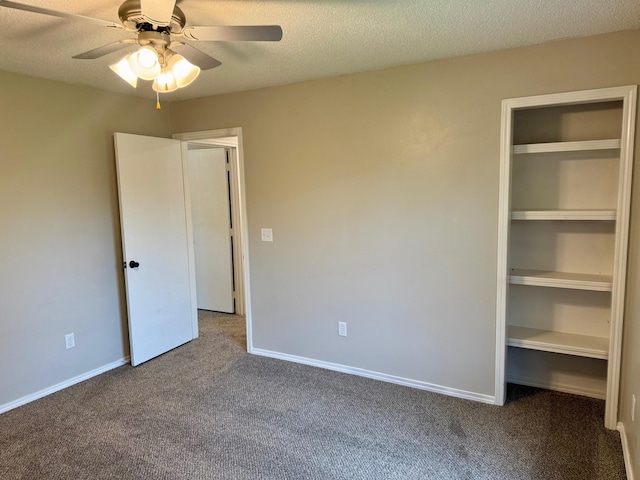 2004 S 16th St, Ozark, MO 65721 - unfurnished bedroom with carpet, a closet, baseboards, a textured ceiling, and ceiling fan