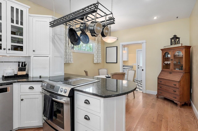 401 E Glendale St, Aurora, MO 65605 - kitchen featuring appliances with stainless steel finishes, a peninsula, white cabinetry, light wood-style floors, and recessed lighting
