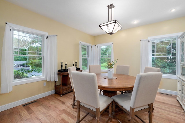 401 E Glendale St, Aurora, MO 65605 - dining room with light wood-style flooring and baseboards
