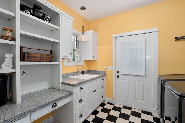 401 E Glendale St, Aurora, MO 65605 - laundry area with separate washer and dryer, dark flooring, and cabinet space