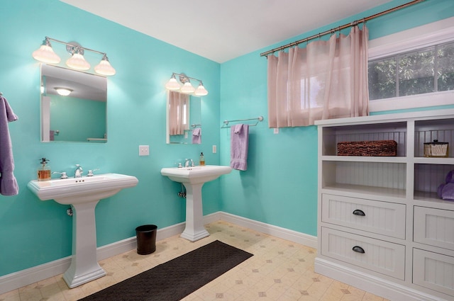 401 E Glendale St, Aurora, MO 65605 - bathroom featuring baseboards, a sink, and tile patterned floors