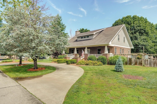 401 E Glendale St, Aurora, MO 65605 - view of front of home featuring curved driveway, a chimney, brick siding, and covered porch