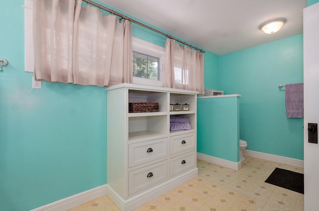 401 E Glendale St, Aurora, MO 65605 - bathroom with baseboards and toilet