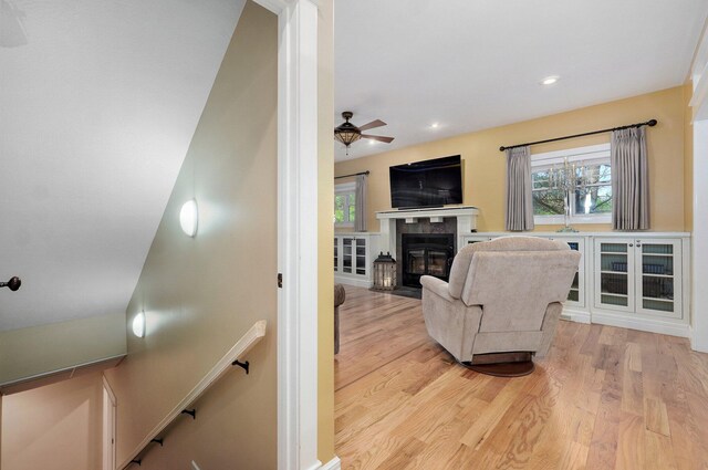 401 E Glendale St, Aurora, MO 65605 - living room featuring a ceiling fan, a fireplace with flush hearth, light wood-style floors, and recessed lighting